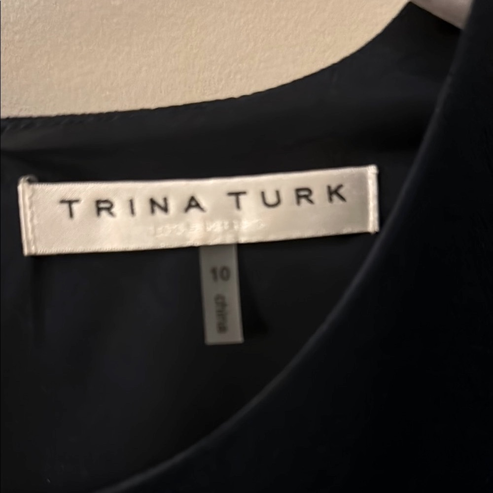 Trina Turk Navy Shift Dress with Elegant Neckline and Sleeve Design.